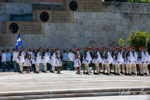 A column of Greek Presidential Guards in front of the Tomb of the Unknown Soldier, Athens.