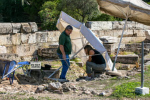 Man and woman gigging at the Temple of Olympian Zeus, Athens, Greece