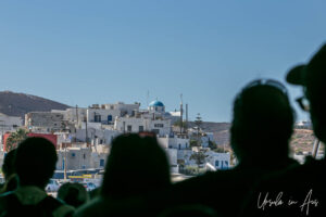Silhouetted people waiting to disembark a ferry on Paros, Greece.