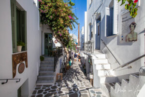 Narrow laneway with stairs and bougainvillea climbing, Parikia, Paros Greece.