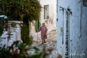 Elderly Greek woman in a Lefkes laneway, Paros Greece.