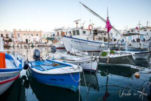 Boats moored on the water, Naoussa Paros Greece.