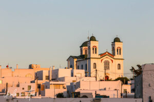 Church of Agia Triada in warm evening light, Naoussa Paros Greece.