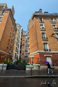 Pedestrian in the rain Rue Blainville, Paris France