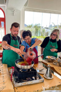 A woman pouring tomato sauce, Platia, Naxos Greece