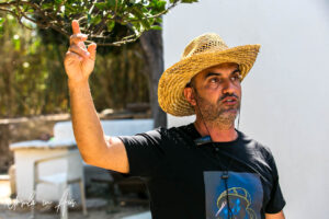 Portrait: Greek farmer explaining his trees, Galini Village, Naxos Greece