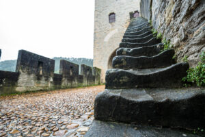 Black stairs to a Pont Valentré tower, Cahors France