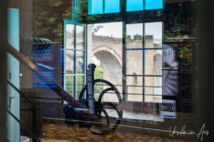 Through a window of la Maison de l'Eau to the Pont Valentré, Cahors France