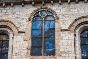 Reflections in coloured windows, the cloisters of Cahors Cathedral, France