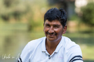 Environmental portrait: a smiling shikara boatman, Dal Lake, Jammu and Kashmir, India