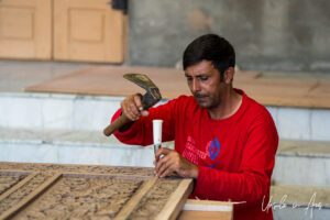 Woodcarver with a chisel and hammer, Srinagar, Jammu and Kashmir, India