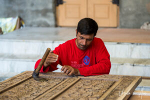 Woodcarver with a chisel, Srinagar, Jammu and Kashmir, India