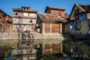 Reflections of tall buildings on the waterways, Dal Lake, Jammu and Kashmir, India