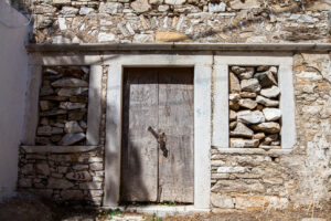 Wooden door in a stone wall, Apeiranthos, Naxos, Greece