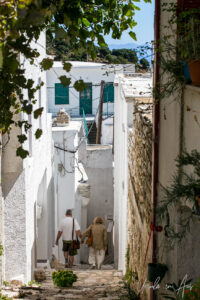 People walking down a narrow stairway, Apeiranthos, Naxos, Greece