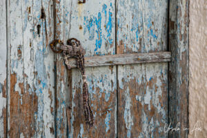 Detail: section of a wooden door and fabric tie, Apeiranthos, Naxos, Greece