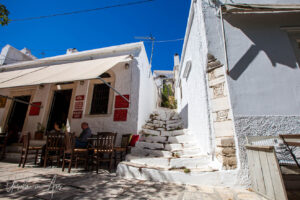 People outside a taverna in the market, Apeiranthos, Naxos, Greece
