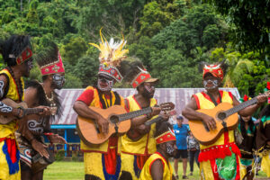 Papuans musicians in traditional costume, Kwatisore, Papua Indonesia