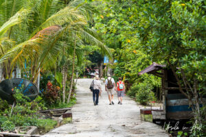 People walking in a Kwatisore street, Papua Indonesia