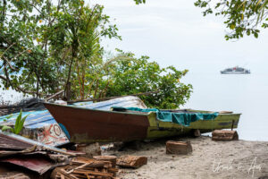 Broken wooden rowboat, Kampung Akudiomi waterfront Kwatisore Bay, Papua Indonesia