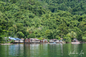 Houses on the Kampung Akudiomi waterfront Kwatisore Bay, Papua Indonesia