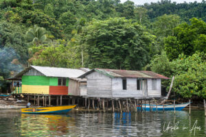 Houses on the Kampung Akudiomi waterfront Kwatisore Bay, Papua Indonesia