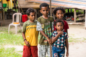 Portrait of four Papuan youngsters, Kwatisore, Indonesia