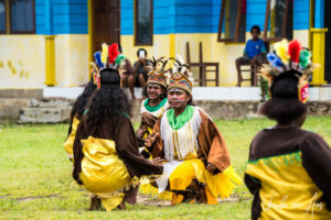 Young Papuans dancing their bird of paradise dance, Kwatisore, Indonesia
