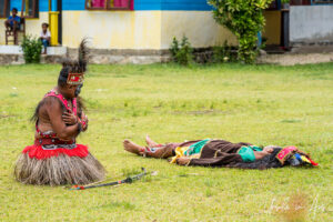 Young Papuans dancing their bird of paradise dance, Kwatisore, Indonesia