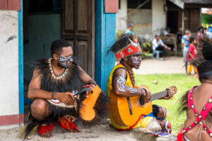 Papuans musicians in traditional costume, Kwatisore, Papua Indonesia