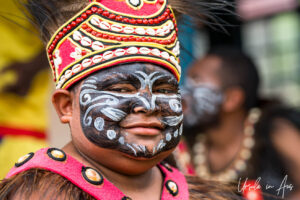 Portrait: young Papuan in traditional costume, Kwatisore, Indonesia