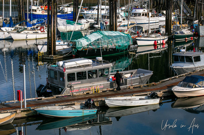 Haida Style boat on the wooden dock, Daajing Giids, Haida Gwaii, BC Canada.