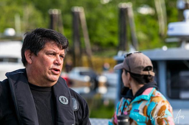Portrait: Haida man on a boat dock, Daajing Giids, Haida Gwaii, BC Canada.