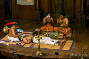 Men applying face paint on stage, Kerala Kathakali Centre, Fort Kochi, India