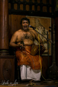 Singing man with cymbals, Kerala Kathakali Centre, Fort Kochi, India