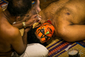 A man painting another man's face, Kerala Kathakali Centre, Fort Kochi, India
