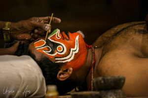 A man painting another man's face, Kerala Kathakali Centre, Fort Kochi, India