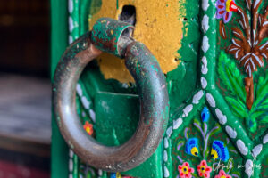 Detail: Paint and patterns and a round door pull, Shah-e-Hamadan Mosque, Srinagar, Jammu and Kashmir, India.