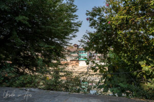 View over the Jhelum River through the trees, Shah E Hamdan Mosque, Srinagar, Jammu and Kashmir, India.