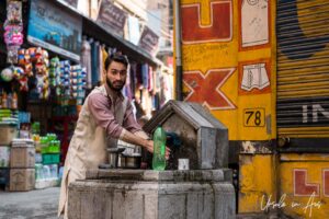 Man washing at a public tap, Srinagar, Jammu and Kashmir, India.