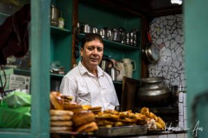 Environmental Portrait: man in a food shop, Old Srinagar, Jammu and Kashmir, India.