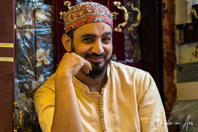 Portrait of a smiling man in a topi, Srinagar Nowhatta, Jammu and Kashmir, India. 
