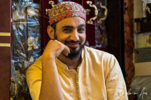 Portrait of a smiling man in a topi, Srinagar Nowhatta, Jammu and Kashmir, India.