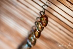 A row of paper mache cones hanging, Kawoosa Arts and Crafts, Srinagar, Jammu and Kashmir, India.