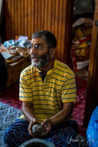 Craftsman with wet paper mache, Kawoosa Arts and Crafts, Srinagar, Jammu and Kashmir, India.