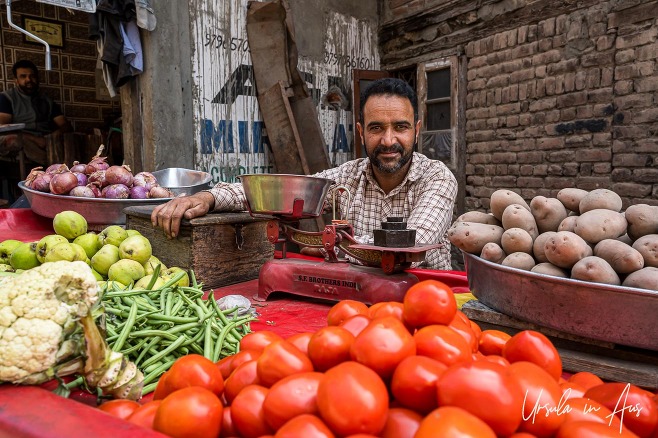 Man with scales and fresh vegetables, Srinagar Nowhatta, Jammu and Kashmir, India. 