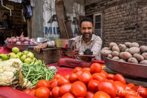 Man with scales and fresh vegetables, Srinagar Nowhatta, Jammu and Kashmir, India.