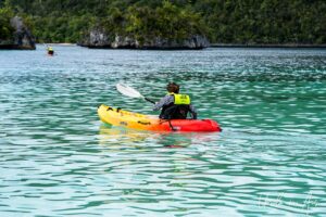 Kayaker in the islands, Pulau Wayag, Southwest Papua Indonesia