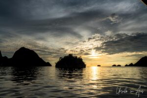 Dark islands in a yellow sky, Pulau Wayag, Southwest Papua Indonesia