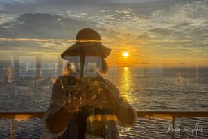 A window-reflection-selfie against a tropical sunset, Pulau Wayag, Southwest Papua Indonesia